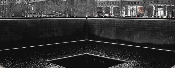 Black and white image of 9/11 memorial in New York City
