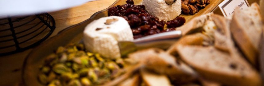 Charcuterie board with cheeses, nuts and dried fruit