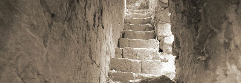 Three sepia toned images: close-up of woman's face; stone stairs in an old building; pair of intertwined hands