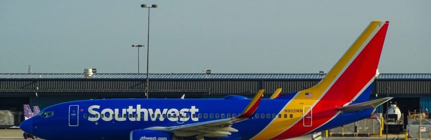 Southwest Airlines plane parked at airport gate