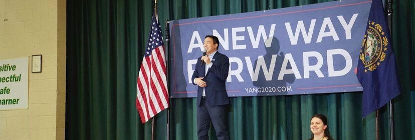 Andrew Yang giving speech on a stage