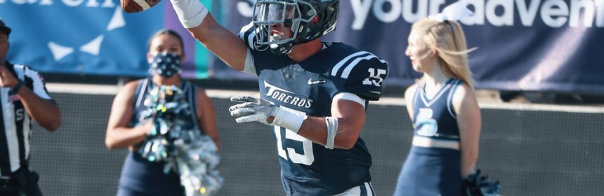 Football player making a catch during a game