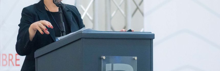Woman speaking at podium