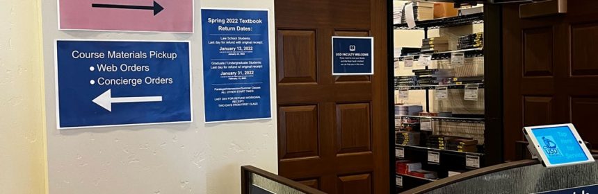 Signs on USD campus directing students to random COVID testing site