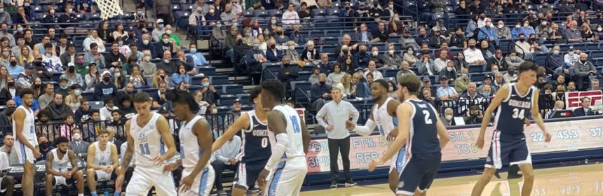 Basketball players on court during game