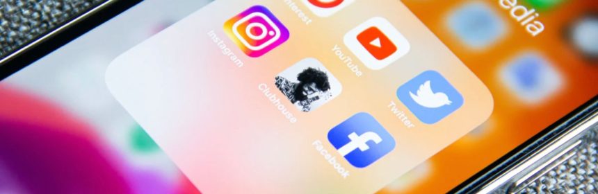 Phone with screen open to social media app icons
