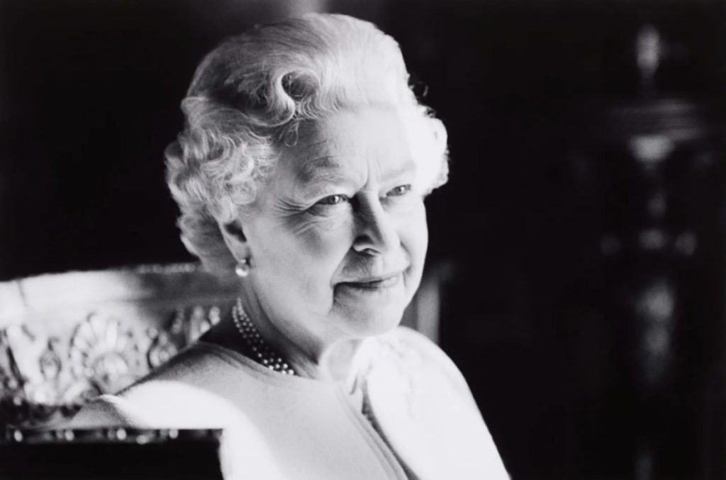 black and white photo of old lady smiling